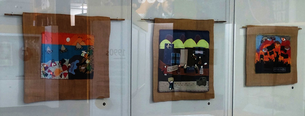 The three-piece installation of Chilean arpilleras from Conflict Textiles collection on display
at the Ulster Museum. (Photo: Karen Logan)