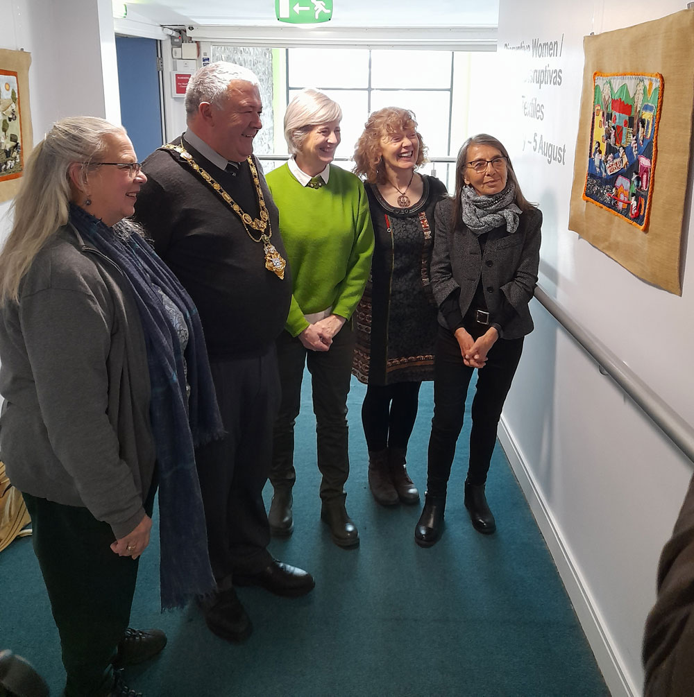 The Conflict Textiles team  with Councillor Ivor Wallace, Mayor of Causeway Coast and Glens at the launch of the 'Mujeres Disruptivas' exhibition in Flowerfield Arts Centre, 8 February, 2023. (Photo: Conflict Textiles)